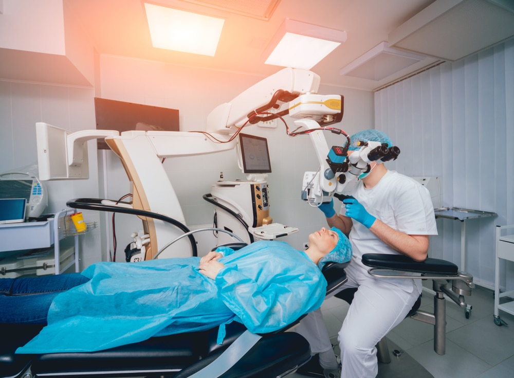 Patient laying ready in an eye surgery operating room, ready for their PRK treatment. Patient laying ready in an eye surgery operating room, ready for their PRK treatment.